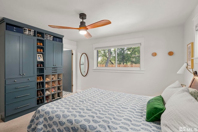 carpeted bedroom with ceiling fan