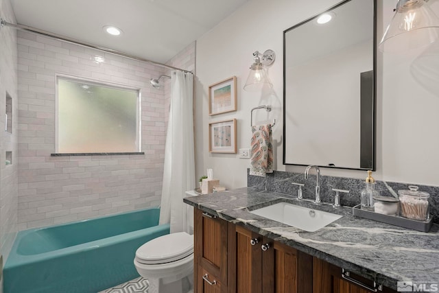 full bathroom featuring vanity, toilet, and shower / bath combo