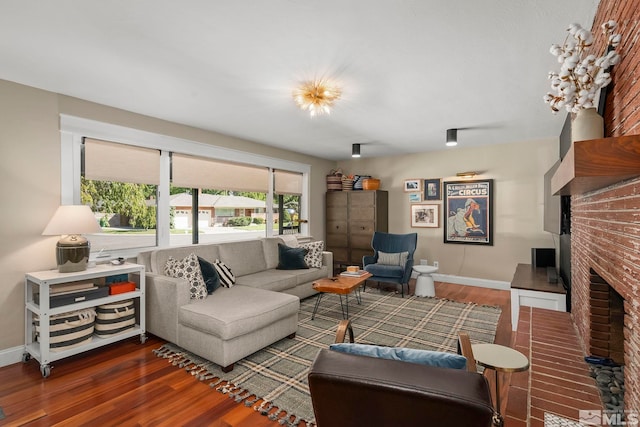 living room featuring a fireplace and dark hardwood / wood-style floors