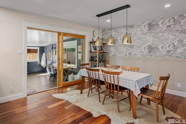 dining room with wood-type flooring