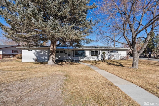 single story home featuring a front yard