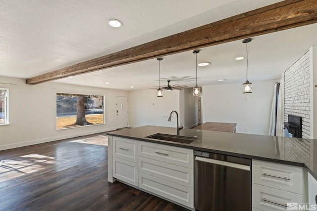 kitchen featuring sink, hanging light fixtures, stainless steel dishwasher, beam ceiling, and white cabinets