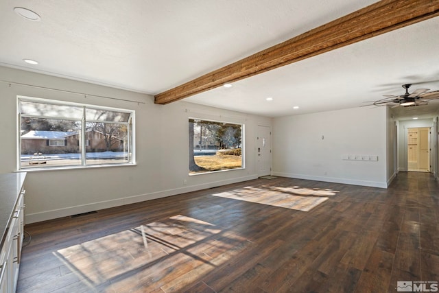 interior space with dark hardwood / wood-style floors, ceiling fan, and beam ceiling