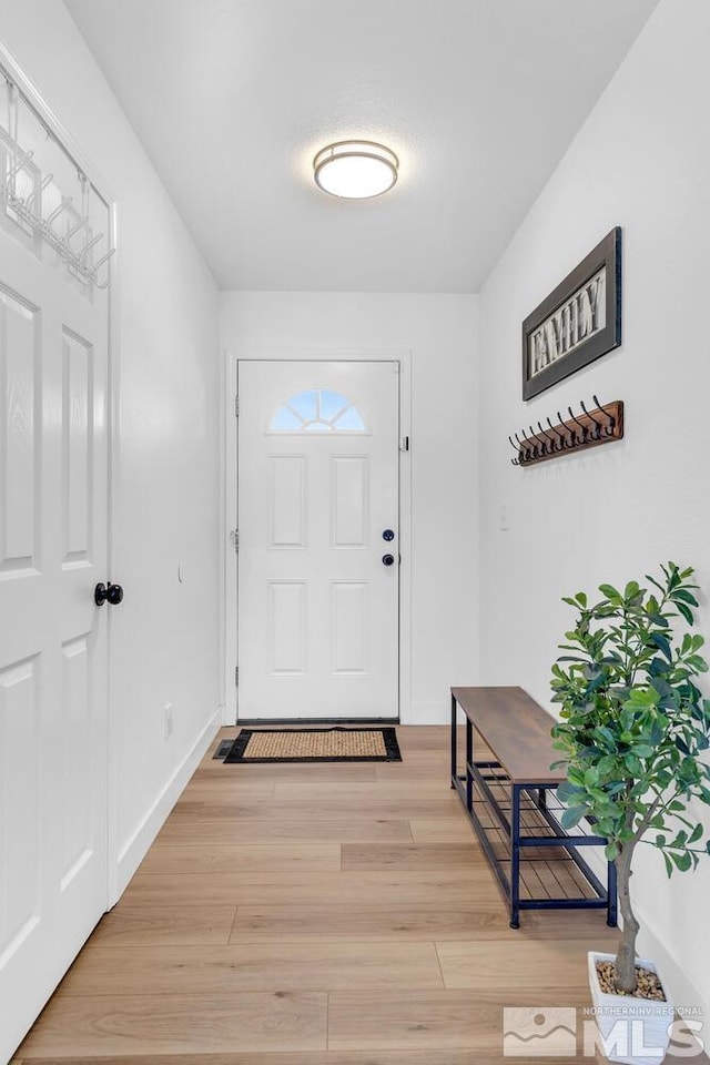 doorway to outside with light hardwood / wood-style flooring