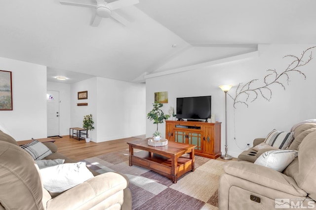 living room featuring lofted ceiling, ceiling fan, and light wood-type flooring