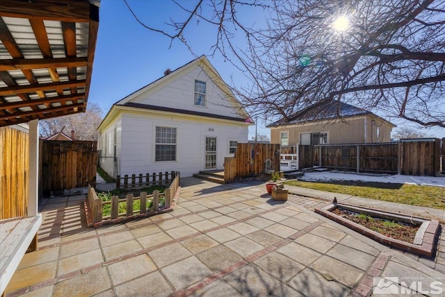 rear view of property with a patio area