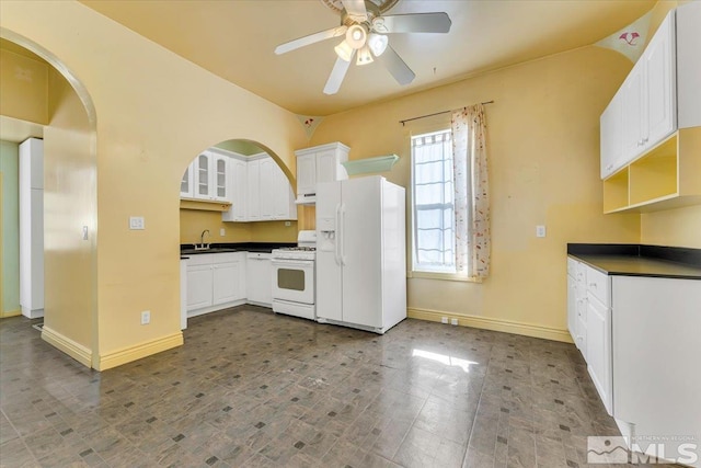 kitchen featuring ceiling fan, white appliances, sink, and white cabinets