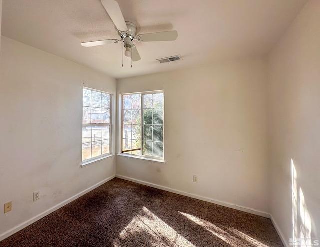 carpeted empty room with ceiling fan