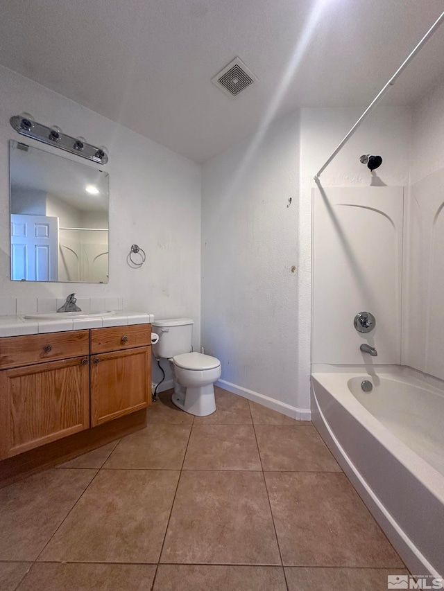 full bathroom featuring tile patterned flooring, vanity, toilet, and shower / bath combination