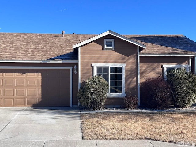 ranch-style house featuring a garage