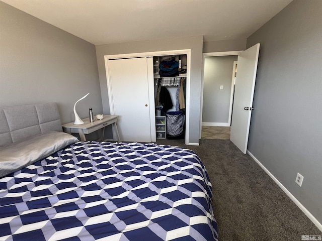 bedroom with dark carpet and a closet