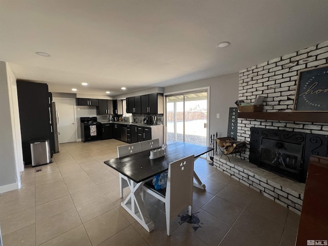 tiled dining space with a fireplace