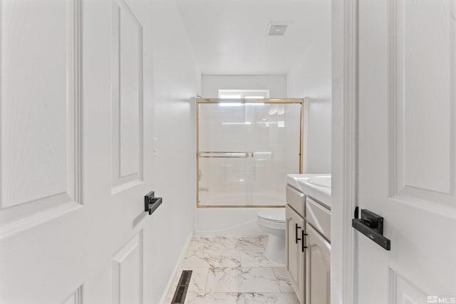 full bathroom featuring vanity, toilet, and combined bath / shower with glass door