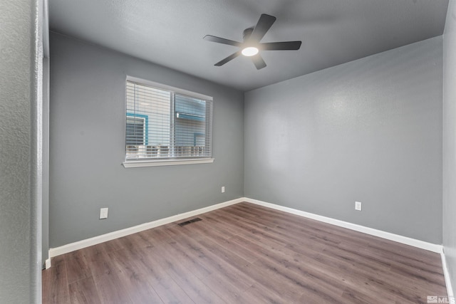 unfurnished room featuring ceiling fan and hardwood / wood-style floors