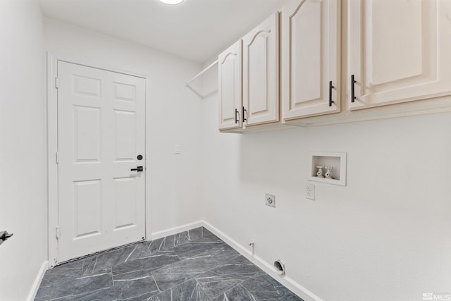 laundry area with gas dryer hookup, cabinets, hookup for a washing machine, and hookup for an electric dryer