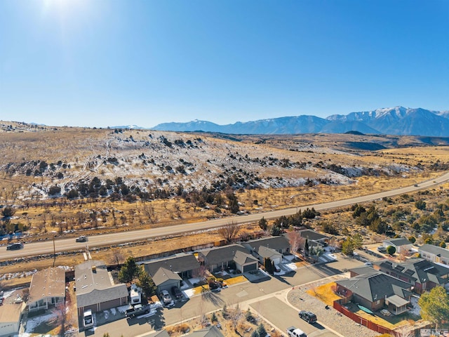 birds eye view of property featuring a mountain view