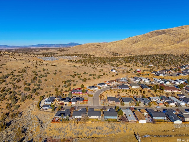 birds eye view of property featuring a mountain view