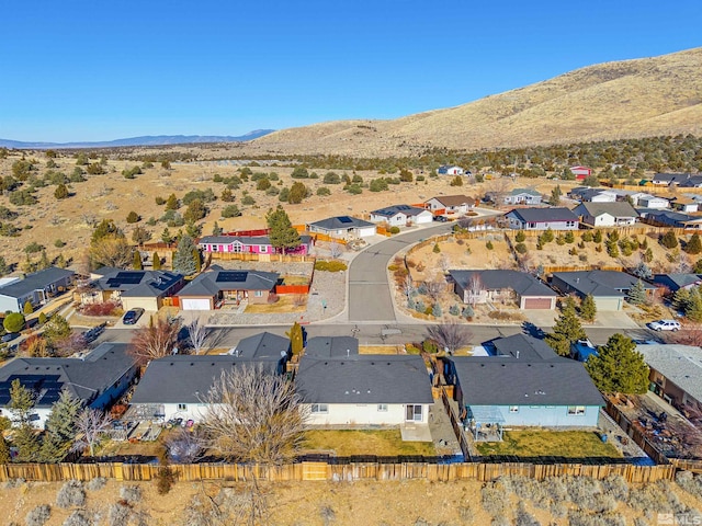 birds eye view of property featuring a mountain view