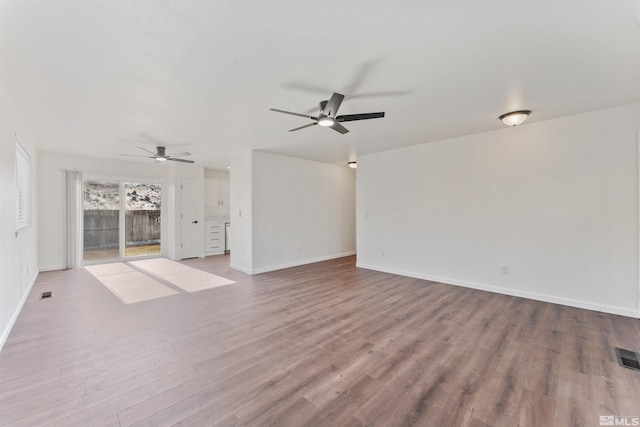 unfurnished living room with ceiling fan and light wood-type flooring