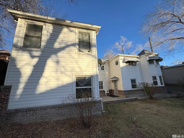 rear view of property featuring a patio