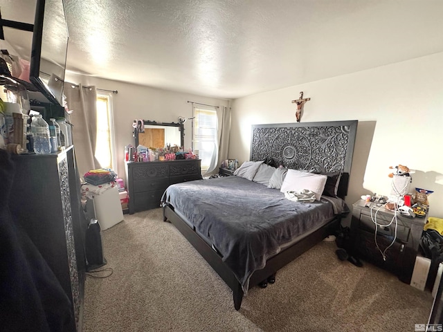 carpeted bedroom with a textured ceiling