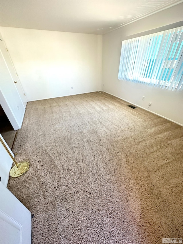 unfurnished room with carpet floors