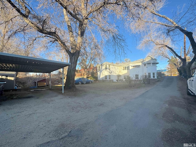 exterior space with a carport