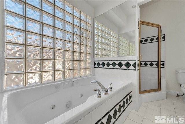 bathroom with tile patterned flooring, separate shower and tub, and toilet