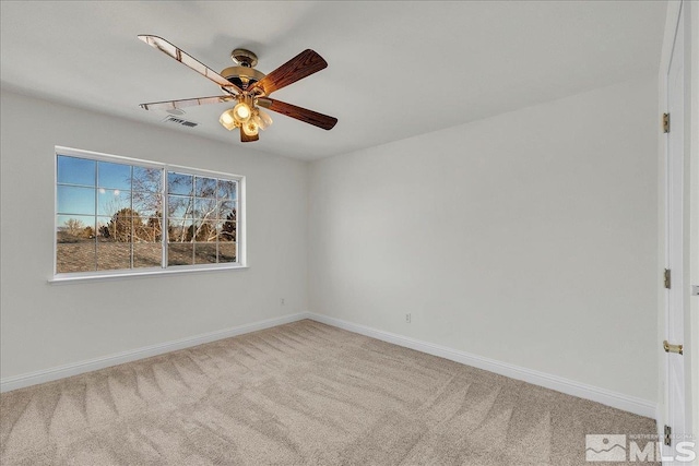 empty room with light colored carpet and ceiling fan