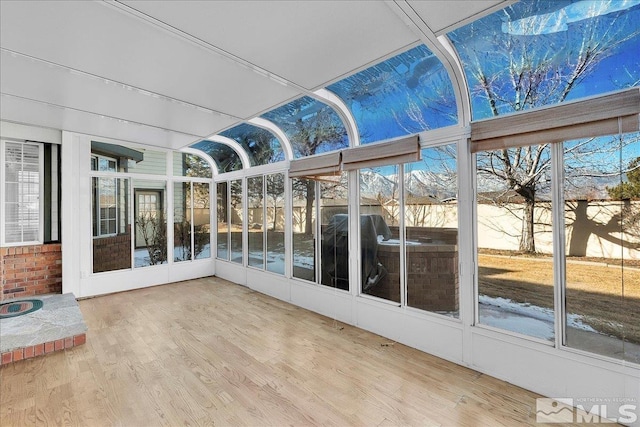 unfurnished sunroom with a wealth of natural light