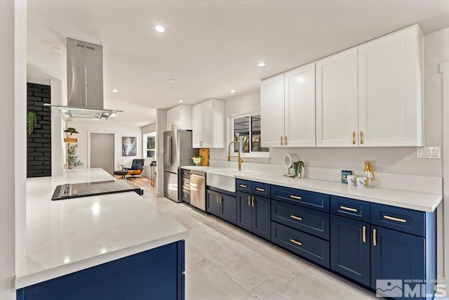 kitchen featuring blue cabinetry, sink, white cabinetry, island exhaust hood, and stainless steel appliances