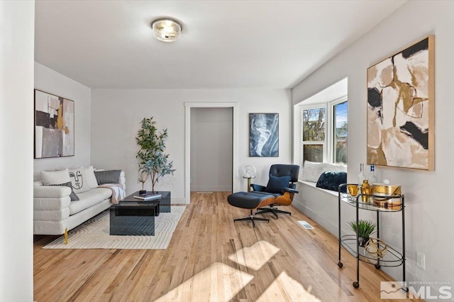 living room with light hardwood / wood-style floors