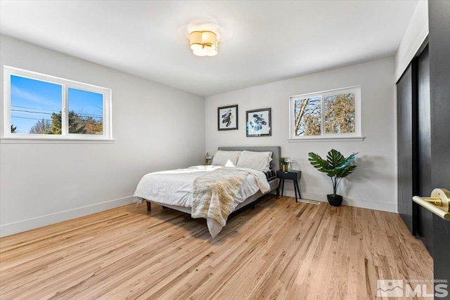 bedroom with light wood-type flooring