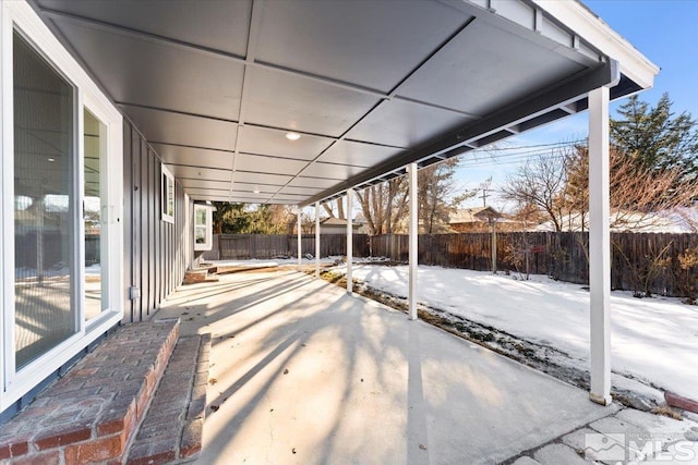 view of snow covered patio