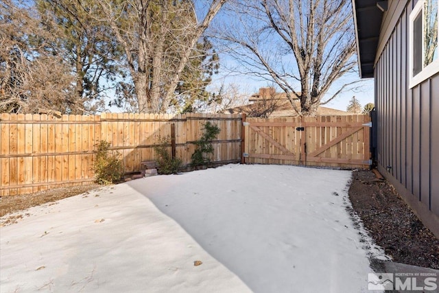 view of yard layered in snow