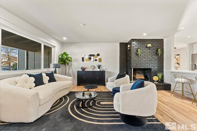 living room featuring hardwood / wood-style floors and a fireplace