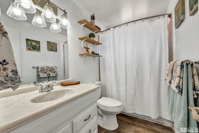 full bathroom with vanity, hardwood / wood-style flooring, shower / bath combination with curtain, and toilet