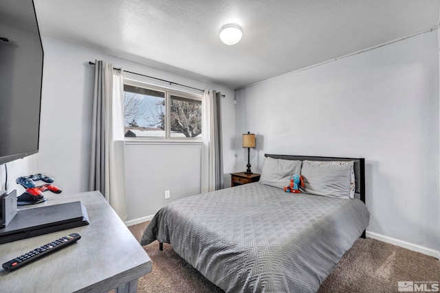 carpeted bedroom with a textured ceiling