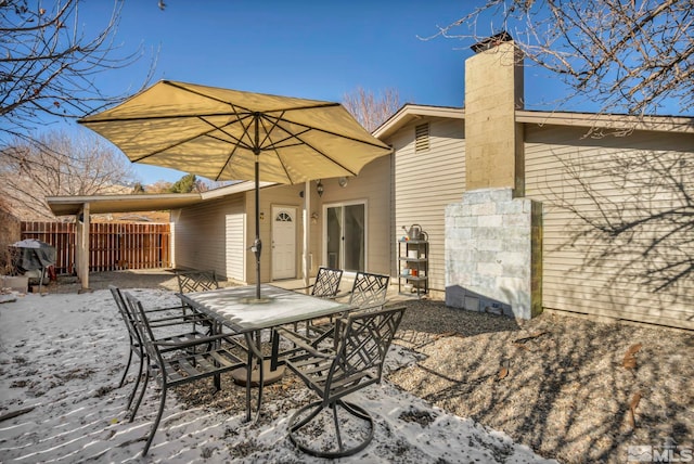 view of snow covered patio