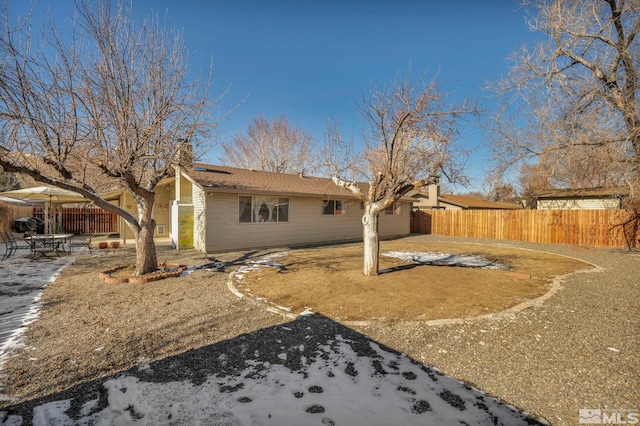 snow covered property featuring a patio area