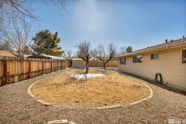 view of yard featuring a storage unit