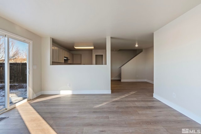 spare room featuring light hardwood / wood-style flooring