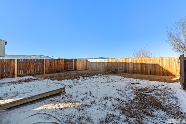 view of yard layered in snow