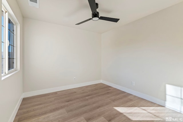 spare room featuring ceiling fan and light wood-type flooring