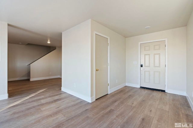 spare room with light wood-type flooring