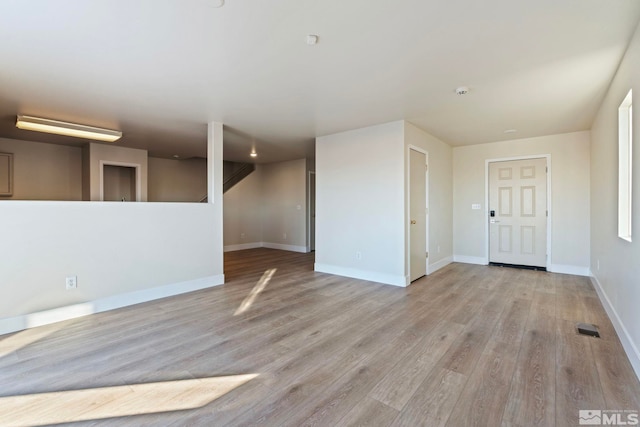 spare room with light wood-type flooring