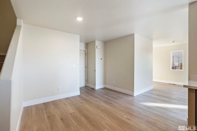 empty room with light wood-type flooring