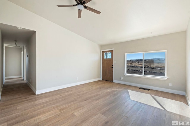 entryway featuring vaulted ceiling, light hardwood / wood-style floors, and ceiling fan