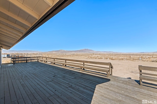 wooden deck featuring a mountain view