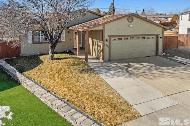 ranch-style house featuring a garage and a front lawn